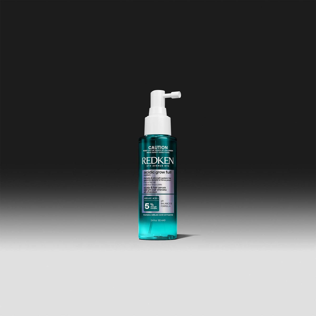 Redken Acidic Grow Full System Scalp & Hair Serum 100 mL — pump spray bottle on a dark background